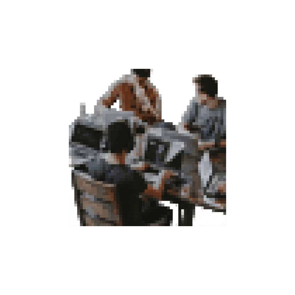 Two people in warm conversation across a small table — an advisor discussing a trip with a client.