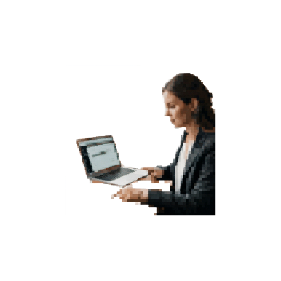 A travel advisor at a desk cross-checking a printed itinerary against a laptop screen showing flight details